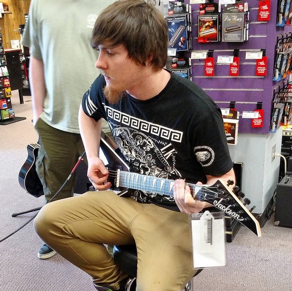 tj checking out guitar 2016